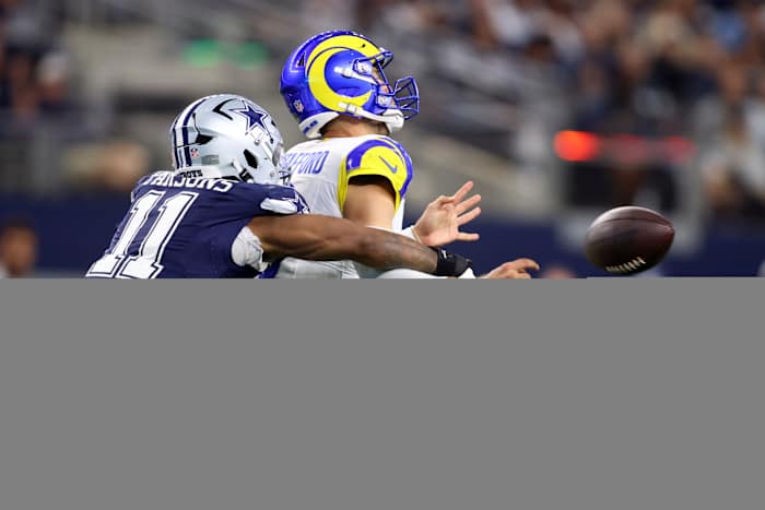 Dallas Cowboys linebacker Micah Parsons (11) attempts to sack Los Angeles Rams quarterback Matthew Stafford (9) in the second quarter at AT&T Stadium.